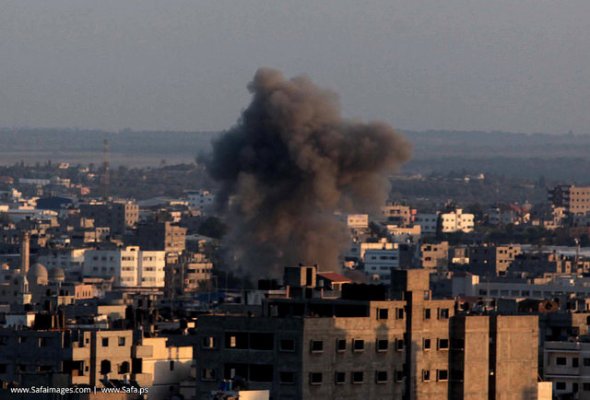 Smoke billows from a building hit by an Israeli air strike in Gaza City, on July 15, 2014 after Israel accepted Egypt's proposal for ceasefire.